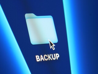 Backup - macro shot of folder on computer desktop with mouse pointer - zooming in on screen pixels