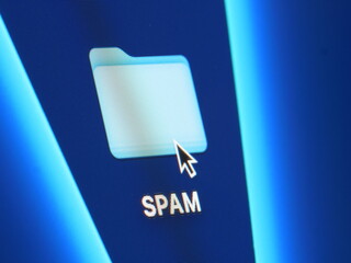 SPAM - macro shot of folder on computer desktop with mouse pointer - zooming in on screen pixels