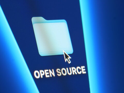 Open source - macro shot of folder on computer desktop with mouse pointer - zooming in on screen pixels