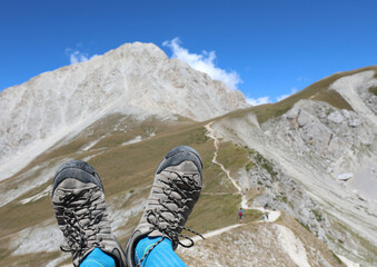 Shoes and Mountains called Gran Sasso in the Abruzzo Region in Italy