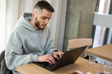 young man working on laptop