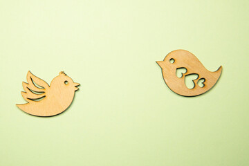 birds carved from wood on different backgrounds