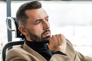 Close-up portrait of a focused businessman who is thinking about something