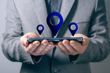 gps icon. man holding a phone in his hand