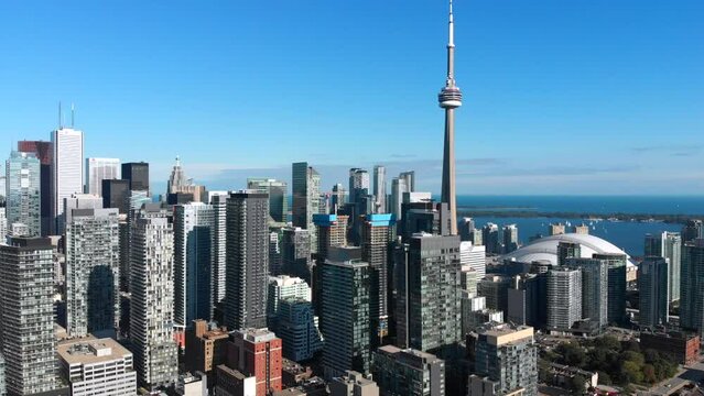 Aerial view of Toronto skyline including architectural landmark CN Tower and modern buildings in the financial district, Toronto, Ontario, Canada, establishing shot.