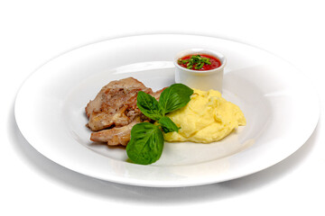 Roast pork with tomato sauce and mashed potatoes