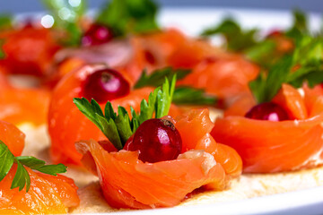 Canapes with lightly salted salmon and lingonberries