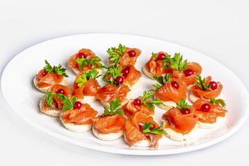 Canapes with lightly salted salmon and lingonberries