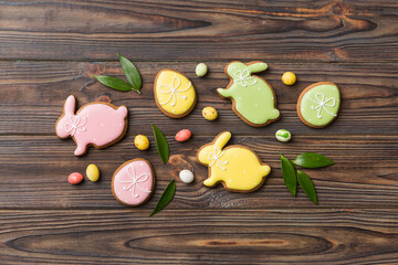 holiday preparation Multi colors Easter eggs with cookies on colored background . Pastel color Easter eggs. holiday concept with copy space