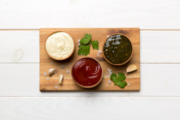 Many different sauces and herbs on table, flat lay top view. sauces on plate, healthy concept