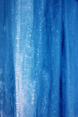 Fototapeta na wymiar Ice and icicle formation. Beautiful shape of a melting icicle. Crooked icicles 