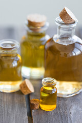 Assortment of organic essential oils. Natural moisturizing body and face treatment. Plant extract for healthy young skin. Relaxation, aromatherapy, salon spa. Close up, macro view