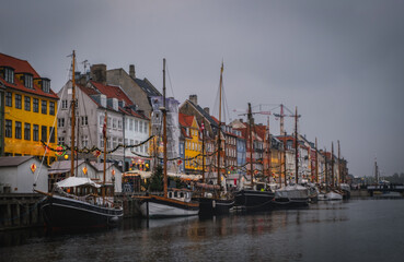 Fototapeta premium Copenhagen, Denmark on the Nyhavn Canal at sunset. November 2021