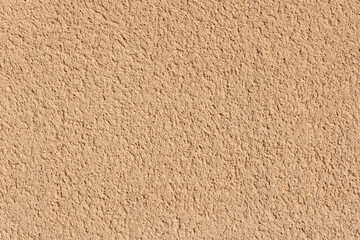 Texture of a yellow ochre wall external render. High quality background.