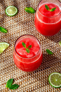 Beverage Drink Photo Of Two Pink Tropical Watermelon, Strawberry, Mint, And Lime Drinks With Fresh Cut Ingredients And An Outdoor Beach Vacation Background. 