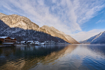 Beautiful winter landscape of Hallstatt mountain village with Hallstatter lake in Austrian Alps