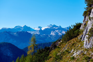 Fototapeta na wymiar Beautiful Foggy Landscape in Austrian Alps with top mountains.