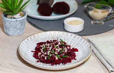 Beet salad with tahini, parsley and sesame seeds.