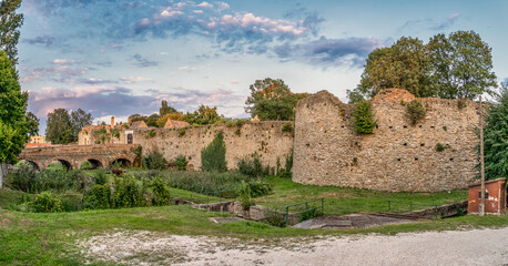 Fototapeta na wymiar Late afternoon view of Tata castle rondel and moat turned into a garden 