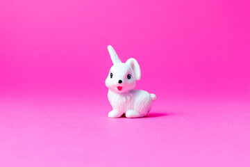 Little white rabbit on pink background Holiday Concept