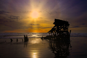 Long abandoned shipwreck rusting in the ocean