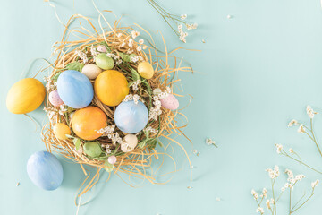 Easter blue and yellow eggs in nest