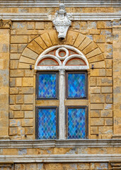 Medieval building with a stained glass window