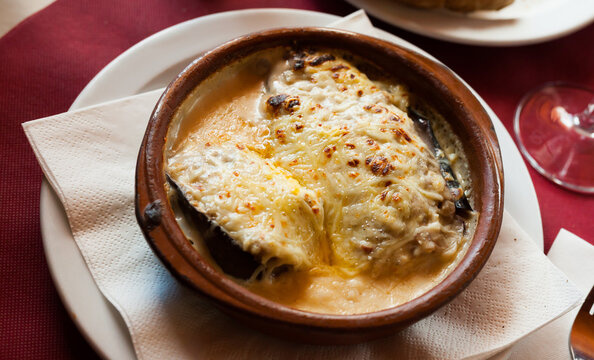 Traditional Spanish stuffed eggplants (berenjenas rellenas) with forcemeat and molten cheese