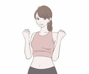 ガッツポーズをするスポーツインストラクターの女性