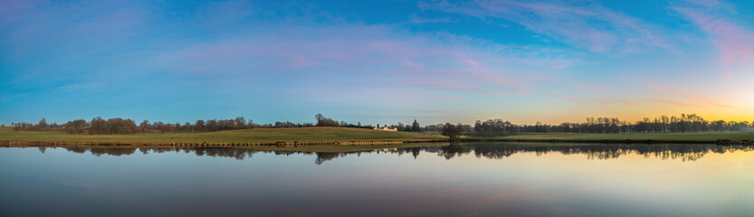 Fototapeta premium Shoulder of Mutton Pond panorama at sunset in Woburn Park. England