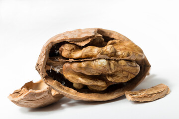 Walnuts are rounded, single-seeded stone fruits of the walnut tree. Cracking a nut.
