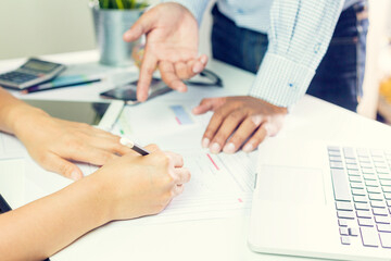 Young businessmen are brainstorming, researching, planning, marketing and khre your presentation on their desks / Account team meeting.