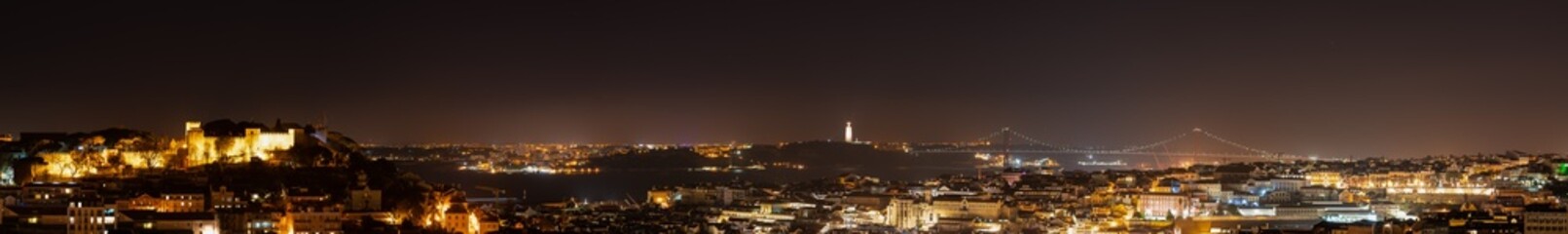 Fototapeta na wymiar Ultra wide skyline panorama of Lisbon at night. Portugal