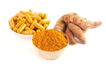 Ground Turmeric in Capsule form on a White Background