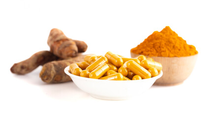 Ground Turmeric in Capsule form on a White Background