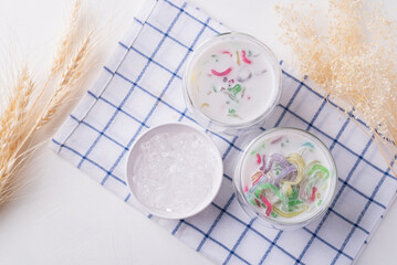 Thai dessert (Lod Chong), Colorful rice flour jelly with coconut milk in glass and ice, Top view
