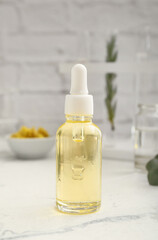 Bottle of natural essential oil in laboratory