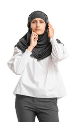 Muslim secretary with headset on light background