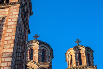 Close up of the towers of Church of Saint Mark, also called Crkva Svetog Marka with its typical orthodox christian cross and dome. It is an orthodox church and a major touristic landmark.....
