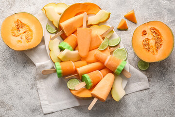 Plate with tasty melon popsicles on light background