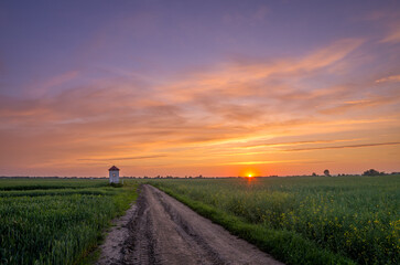 colorful sky at sunrise over the fields