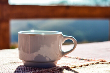 cup of coffee on wooden table