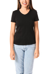 Obraz premium Young woman in blank t-shirt on white background