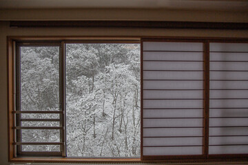 Mountain covered with snow in Japan through Japanese shoji window