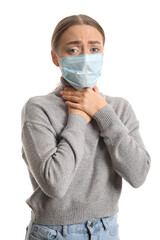 Ill young woman in medical mask isolated on white