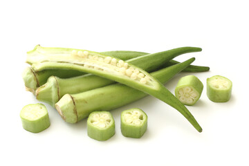 Raw green okra sliced ​​on white background
