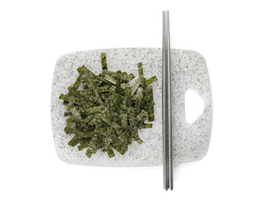 Board with chopped seaweed sheets and chopsticks on white background © Pixel-Shot