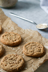 close up of fresh baked oatmeal cookies on baking rack, grey marble table