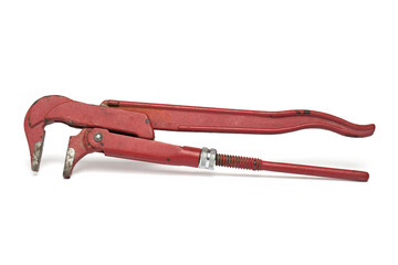 Closeup massive red pipe wrench white background