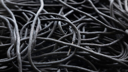 Black tangled threads abstract texture pattern background.A tangled of black shoelaces background.